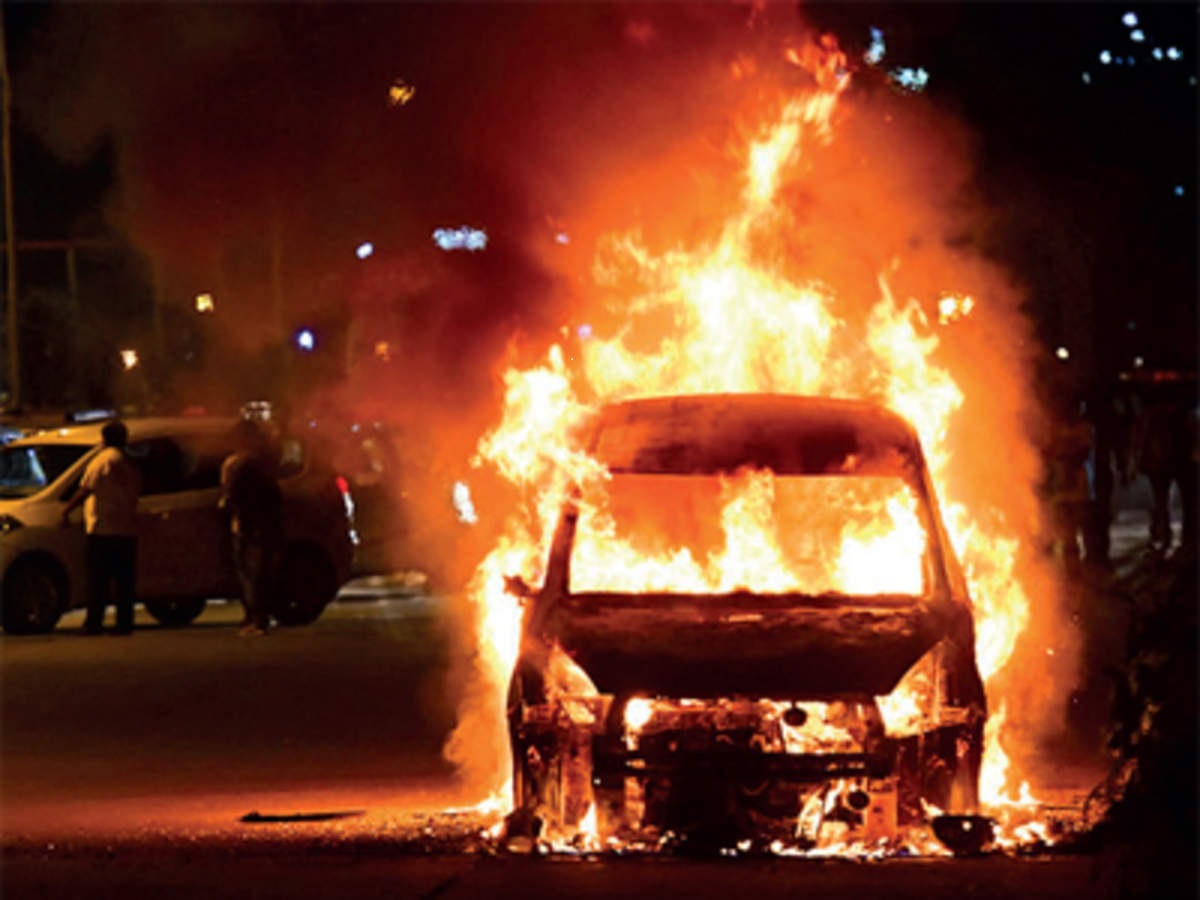 A moving car caught fire on Lokhra National Highway in Guwahati on Thursday. The occupants had a narrow escape as they managed to get out of the car before the flames engulfed the vehicle.